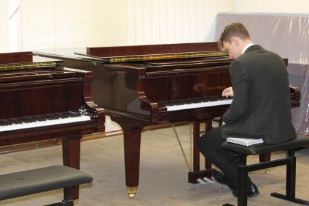 Andrew trying piano